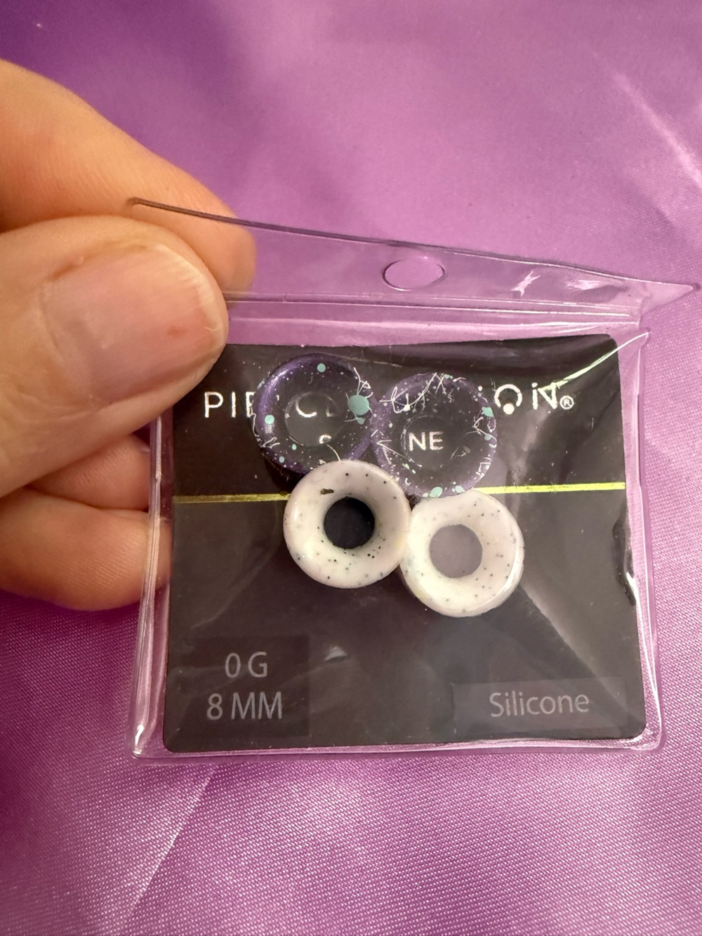 Spencer's White Speckled Silicone Ear Plugs